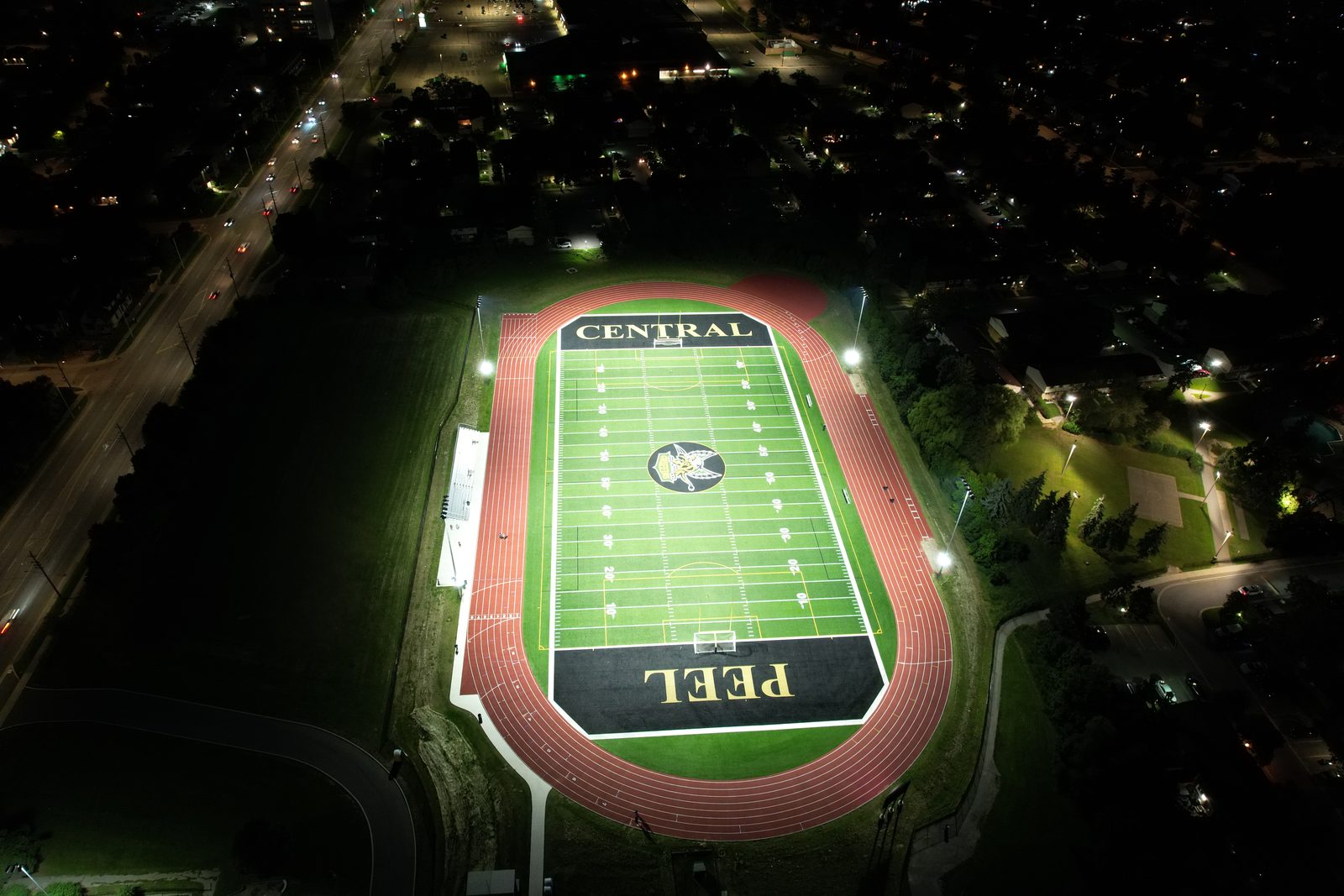 Central Peel football field and track lighting at night