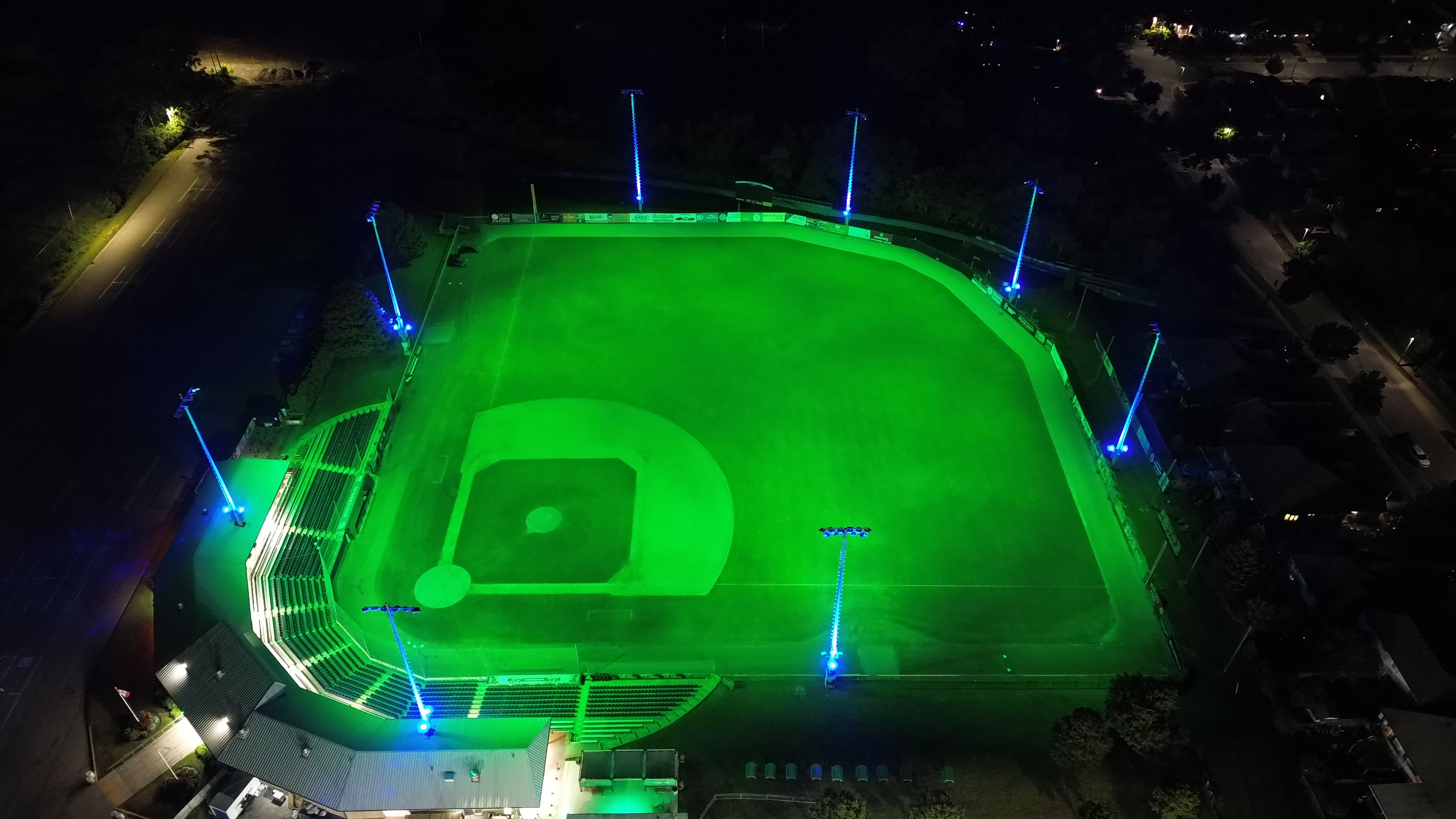 Green field with blue poles from first base