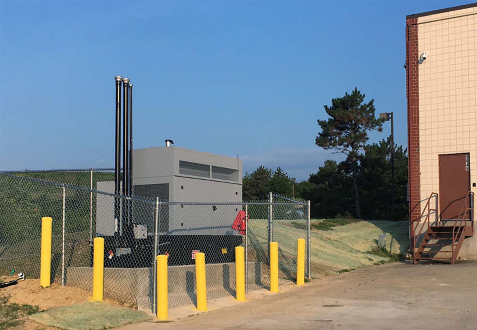 Fenced commercial generator installation