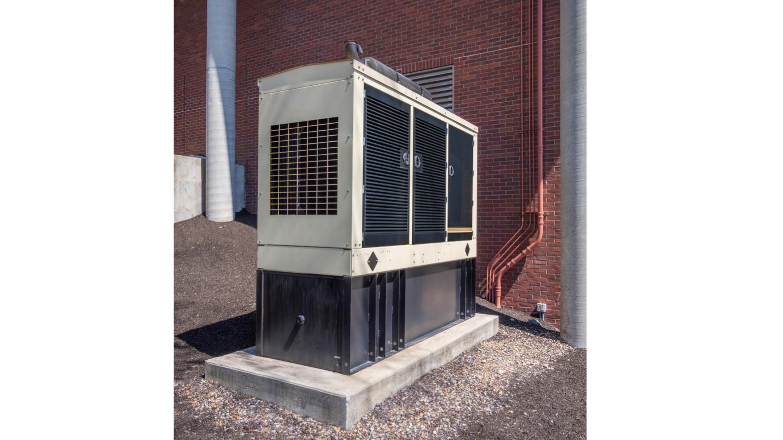 Commercial standby generator on concrete pad